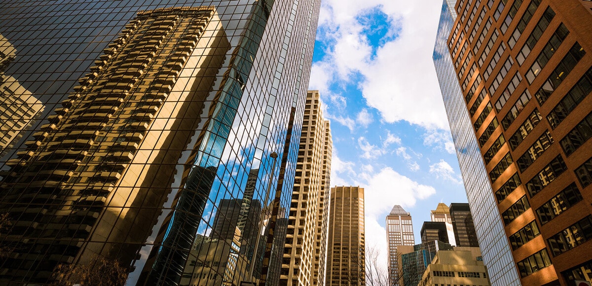 Beautiful skyscrapers with clouds in a blue sky Urban buildings with excellent mortgage rates and terms